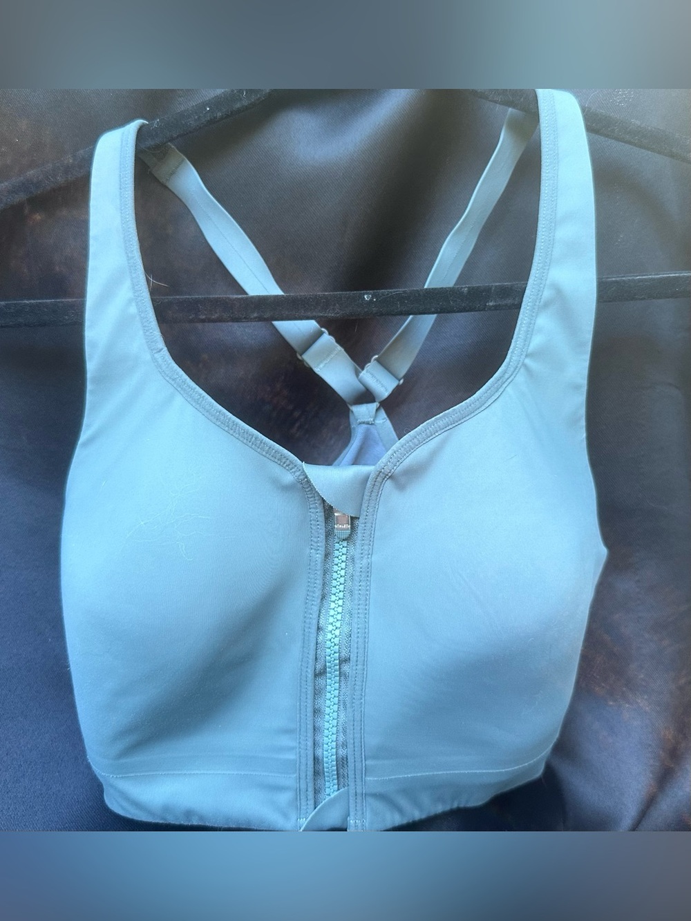 Athleta Advance Zip Front Sports Bra in the color Sequoia Blue.